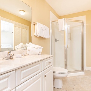 Refresh in this additional guest bath with a walk-in shower and laundry area with a washer and dryer in your rental