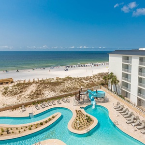 Discover the refreshing pool area with gradual entry, splash pads, inviting lazy rivers and thrilling waterslides