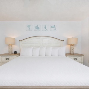 Unwind in this cozy master suite with fluffy pillows and drift off to the sound of gentle waves