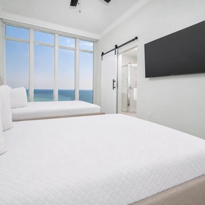 Unwind in this queen guest suite and stream your favorite shows or enjoy a good movie after a beach day