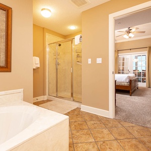 Indulge in relaxation in the master bath with a refreshing walk-in shower and soothing jetted tub
