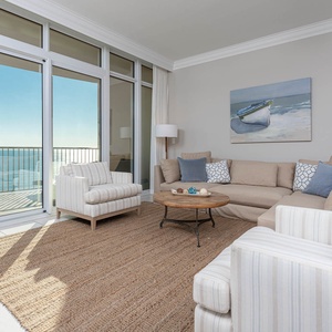 Relax in the inviting living room, where natural light floods in and views of the coast await
