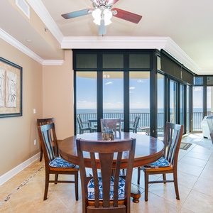Gather around the inviting dining table to share stories as you soak in breathtaking beach views