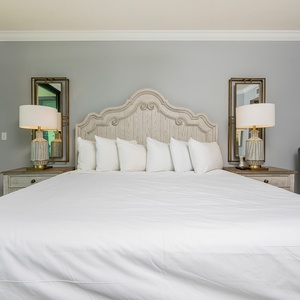 Unwind in the king master suite, surrounded by plush pillows, as you drift off to the sights and sounds of the bay