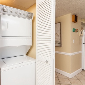 This laundry area features a stacked washer and dryer, providing convenience for your vacation needs