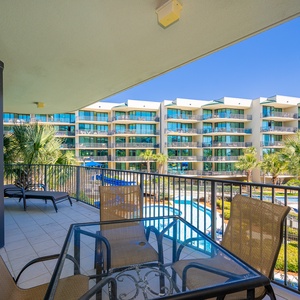 Breathe in the fresh air while lounging on the balcony, enjoying pool views and the tranquility of coastal living