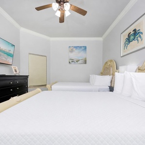 Relax in one of the cozy queen beds in this guest suite and stream your favorite shows after a beach day