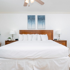 Experience tranquility in this master bedroom, where plush king bedding invites peaceful moments