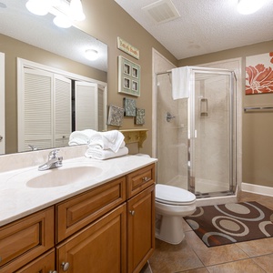 Refresh in this additional guest bath with a walk-in shower and laundry area with a washer and dryer in your rental