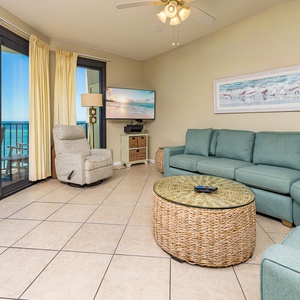 Sink into plush cushions on the sofa with a queen sleeper in the living room with beach views