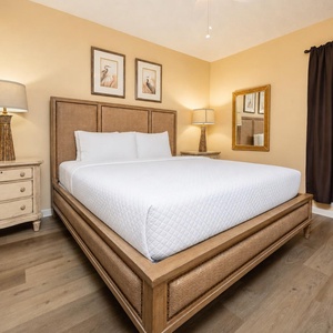 Relax in this inviting king suite featuring a comfortable bed, stylish decor, and a cozy ambiance for restful nights