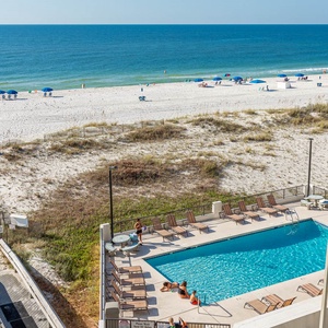 Enjoy stunning beachfront views from this inviting pool area, perfect for relaxation and fun in the sun