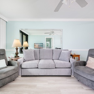 Sink into the plush seating and share laughter in this living space, featuring a sofa with queen sleeper