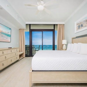 Enjoy restful nights in the king master suite with beachfront balcony access