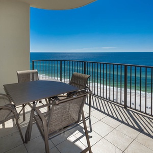 Unwind at your table with family, soaking in breathtaking views while enjoying the coastal vibe from your balcony
