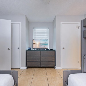 Cozy bunk room with a TV for relaxing with a good movie after a day of adventure
