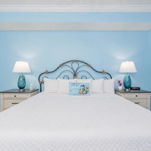Drift into comfort on the king bed in the master, surrounded by tranquil hues that invite rest after a day of adventure