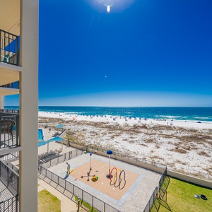 Take in the vibrant beach views while enjoying the outdoor splash park area and inviting seating on your balcony
