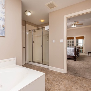 Indulge in relaxation in the master bath with a refreshing walk-in shower and soothing jetted tub