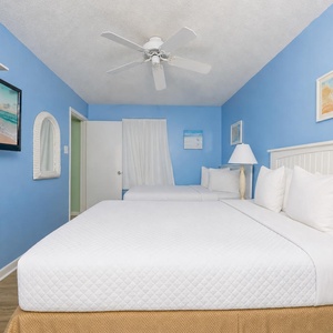 Two queen beds in this guest suite cradle you in peaceful sleep after coastal days filled with adventure