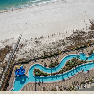 Discover the refreshing pool area with gradual entry, indoor hot tubs and pool, lazy river, and waterslide