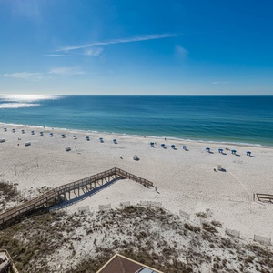 Enjoy breathtaking views of the pristine beach and turquoise waters from your private balcony, perfect for relaxation