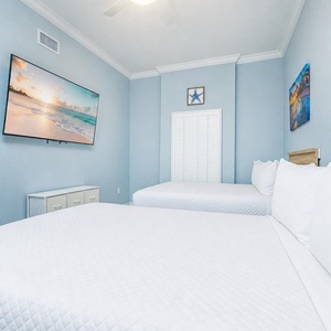 Unwind in this queen guest suite and stream your favorite shows or enjoy a good movie after a beach day