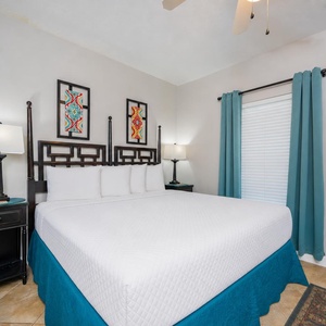 Night lamps glow softly beside the king bed in the guest suite where restful sleep awaits you
