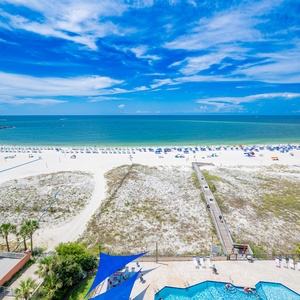 Breathtaking views of the water and beach from your spacious balcony, perfect for relaxation and sunbathing