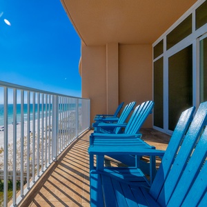 Lounge on the balcony enjoying views of the sparkling shoreline and bright blue skies