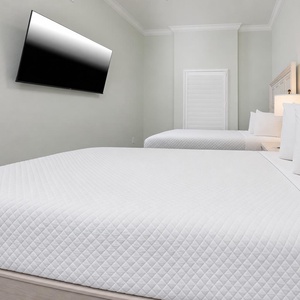 Unwind in this queen guest suite and stream your favorite shows or enjoy a good movie after a beach day