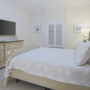 Rest on the plush king bed in this guest suite with a good book or stream your favorite shows