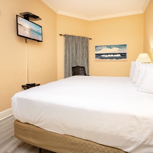 Sink into the plush king bed in this guest suite, enjoying cozy moments or catching up on shows