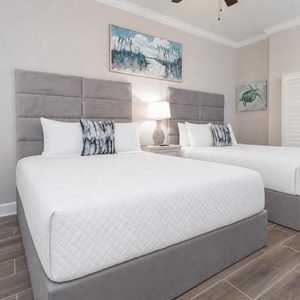 Rest on the fluffy queen beds in the guest suite and admire the fun costal decor under soft lighting