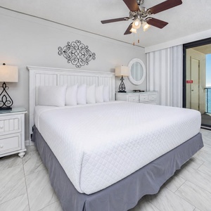 Unwind in the king master suite, enjoying views of the coast from your beachfront balcony