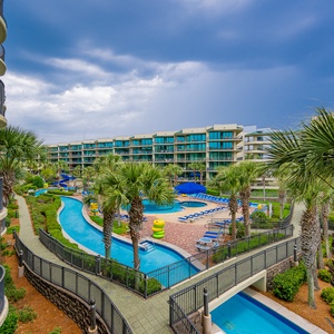 Discover the pool area with a refreshing lazy river and thrilling waterslide, just steps from the bay