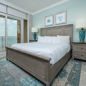 Unwind in the king master suite, where plush bedding promotes restful nights and coastal breezes come from the balcony