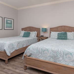 Relax on one of the cozy queen beds in this guest suite and enjoy a peaceful slumber