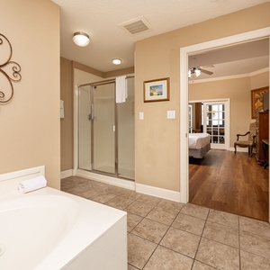 Refresh in the master bath after a day at the beach with a soothing jetted tub and relaxing walk-in shower
