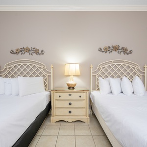 Relax on one of the cozy queen beds in this guest suite and enjoy a peaceful slumber