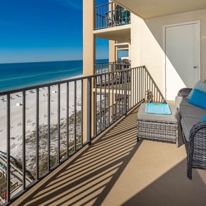 Relax on the balcony with stylish seating and enjoy breathtaking views of the pristine beach and tranquil waters