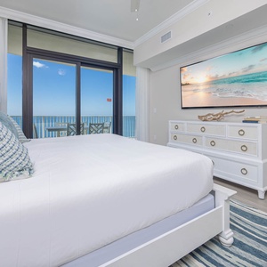 Inviting master bedroom featuring a king bed, stylish decor, and a view that enhances your stay