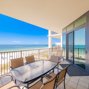 Enjoy impressive views from the spacious balcony, featuring a glass-top dining table and comfortable seating