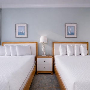 Rest in the guest suite with two queen beds after your day full of shore-side adventures and laughter