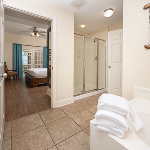 Refresh in the master bath after a day at the beach with a soothing jetted tub and relaxing walk-in shower
