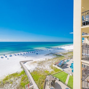 Experience breathtaking views of the white serene beach and turquoise waters from your private balcony