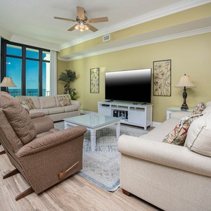 Relax on a plush sofa with queen sleeper as you enjoy a movie, surrounded by coastal views and soothing decor