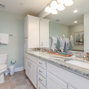 Elevate your routine in the master bath, where a soothing shower and relaxing tub invite you to unwind