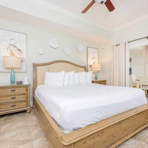 Cozy master suite featuring a plush king bed, elegant decor, and a cozy seating area for relaxation