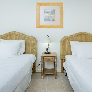 This guest room features two twin beds, offering a comfortable space for restful nights